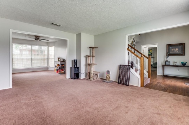 238 Browning Ln, Grand Prairie, TX 75052 - empty room featuring carpet, stairway, a textured ceiling, and ceiling fan
