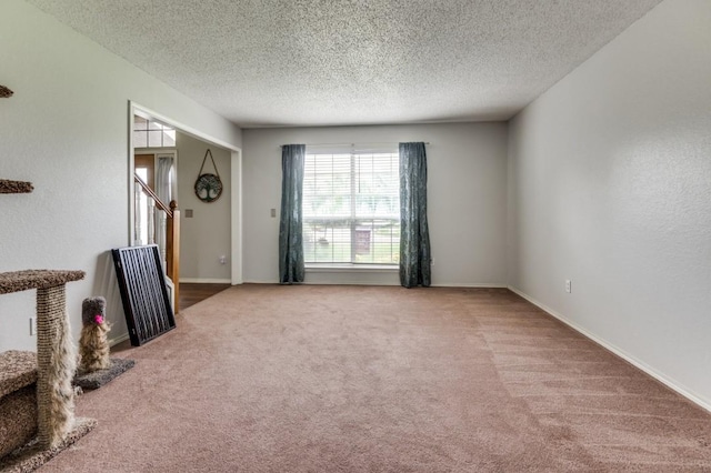 238 Browning Ln, Grand Prairie, TX 75052 - carpeted empty room with a textured ceiling and baseboards