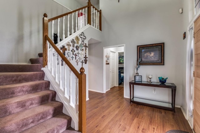 238 Browning Ln, Grand Prairie, TX 75052 - staircase with wood finished floors, baseboards, and a high ceiling