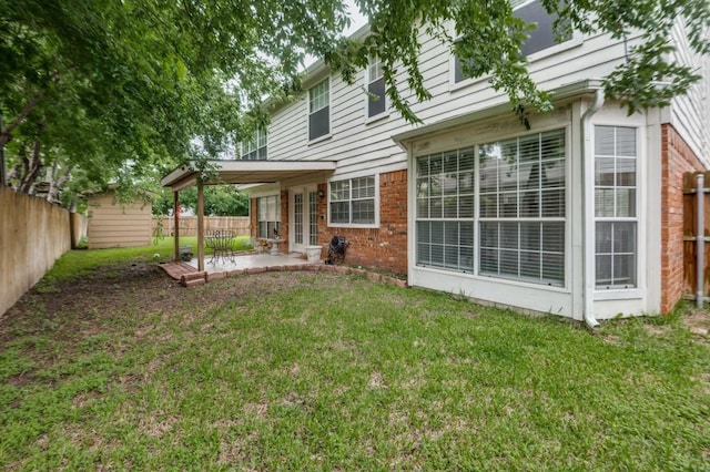 238 Browning Ln, Grand Prairie, TX 75052 - rear view of house featuring a patio area, french doors, brick siding, and a carport