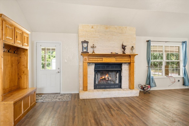 2809 Rock Church Hwy, Tolar, TX 76476 - unfurnished living room featuring vaulted ceiling, wood finished floors, a fireplace, and baseboards