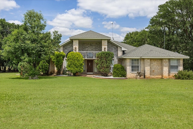 2809 Rock Church Hwy, Tolar, TX 76476 - view of front facade featuring a front yard, roof with shingles, a balcony, and stone siding