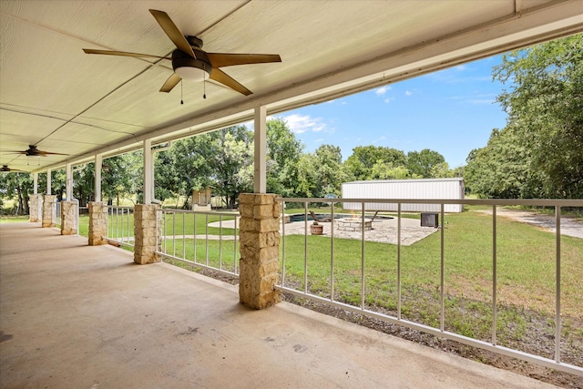 2809 Rock Church Hwy, Tolar, TX 76476 - view of patio / terrace with a ceiling fan and view of wooded area
