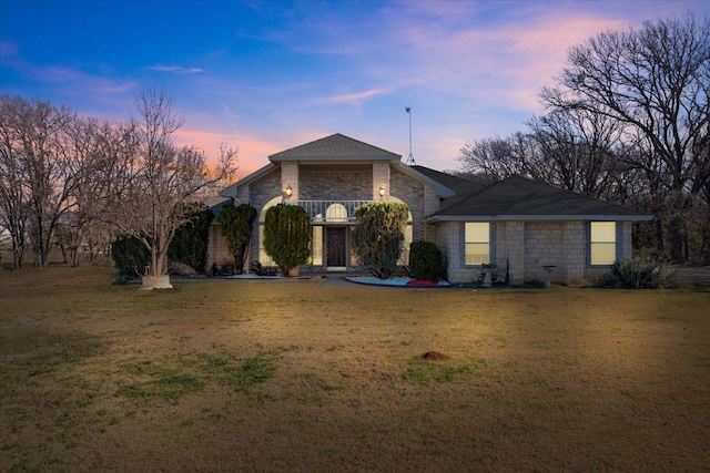 2809 Rock Church Hwy, Tolar, TX 76476 - view of front of house with stone siding, a balcony, and a front lawn