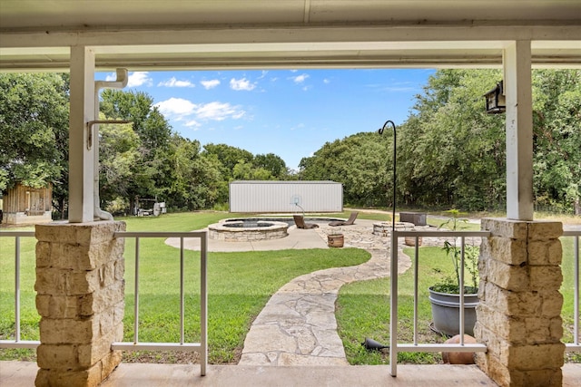 2809 Rock Church Hwy, Tolar, TX 76476 - view of grassy yard featuring a fire pit and view of wooded area