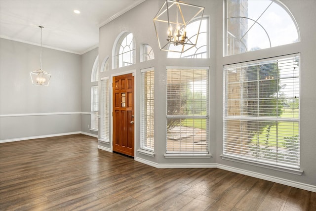 2809 Rock Church Hwy, Tolar, TX 76476 - entrance foyer featuring a chandelier, crown molding, dark wood finished floors, baseboards, and a high ceiling