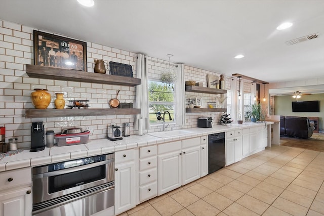 177 Graben Ln, Rhome, TX 76078 - kitchen featuring open shelves, dishwasher, a sink, decorative backsplash, and recessed lighting