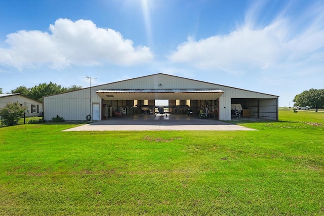 177 Graben Ln, Rhome, TX 76078 - back of house featuring a pole building, a yard, an outbuilding, and a carport