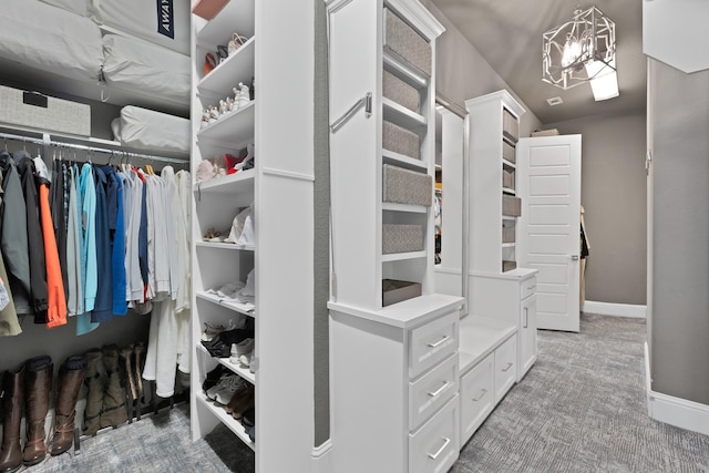 4350 Bristleleaf Ln, Prosper, TX 75078 - walk in closet featuring carpet flooring and a chandelier