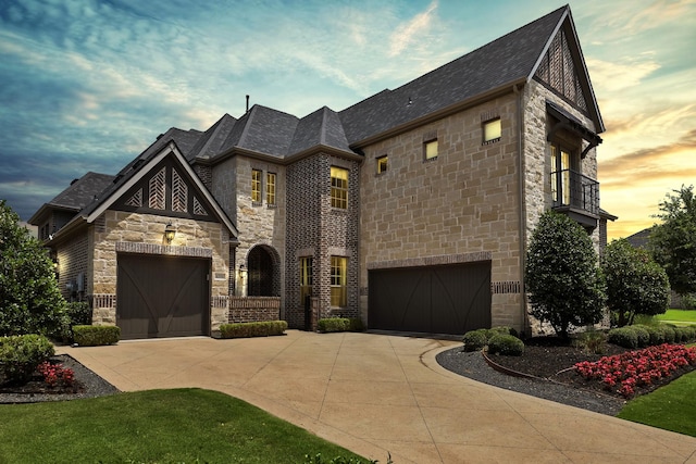 4350 Bristleleaf Ln, Prosper, TX 75078 - french country style house with stone siding, concrete driveway, and a balcony