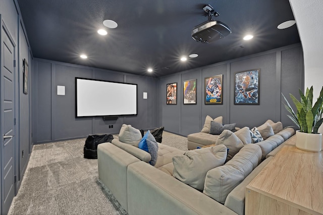 4350 Bristleleaf Ln, Prosper, TX 75078 - carpeted cinema room with a decorative wall and recessed lighting