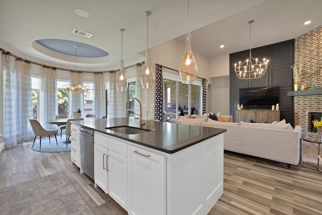 4350 Bristleleaf Ln, Prosper, TX 75078 - kitchen featuring a chandelier, a sink, dark countertops, stainless steel dishwasher, and light wood finished floors