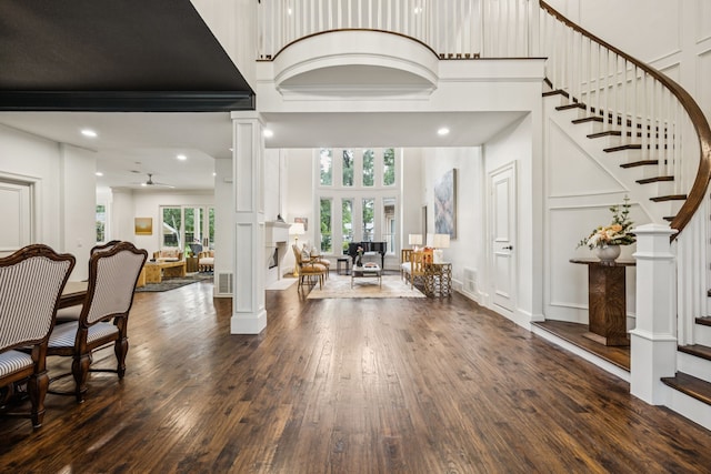 1260 Stanhope Ct, Southlake, TX 76092 - entryway with ornate columns, a high ceiling, stairway, wood finished floors, and a decorative wall