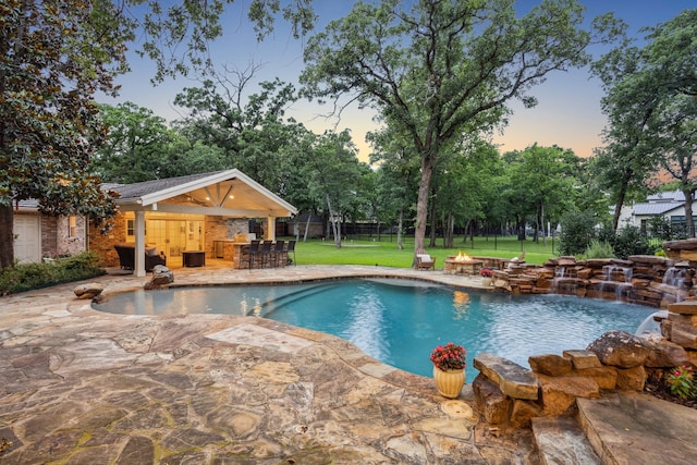 1260 Stanhope Ct, Southlake, TX 76092 - pool at dusk with an outdoor fire pit, a patio, and view of scattered trees