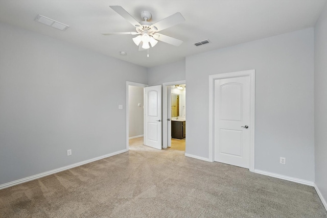 2866 Milsons Point Dr, Trophy Club, TX 76262 - unfurnished bedroom featuring light carpet, connected bathroom, and a ceiling fan