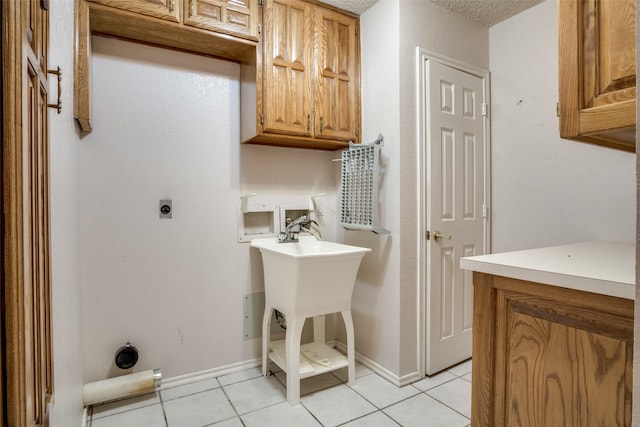 4465 Northern Dancer Dr, Burleson, TX 76028 - laundry room featuring light tile patterned floors, washer hookup, cabinet space, and hookup for an electric dryer