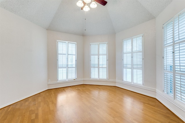 4465 Northern Dancer Dr, Burleson, TX 76028 - unfurnished room featuring lofted ceiling, wood finished floors, a ceiling fan, and plenty of natural light