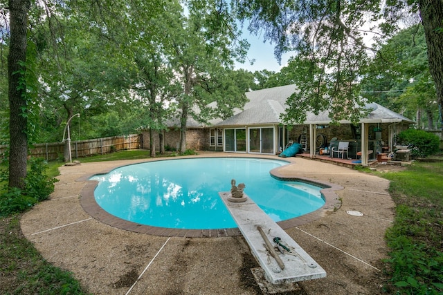 4465 Northern Dancer Dr, Burleson, TX 76028 - view of swimming pool featuring a patio, a fenced backyard, and a diving board