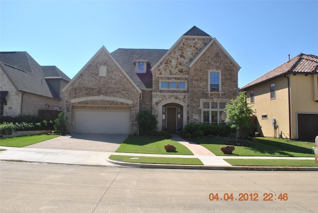 6916 Cannon Falls Dr, Plano, TX 75024 - view of front of property with brick siding, concrete driveway, a front lawn, and stone siding