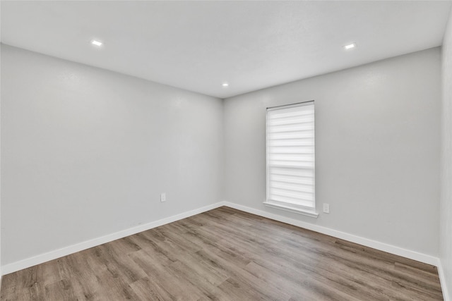 2308 Foxcroft Ln, Arlington, TX 76014 - spare room featuring wood finished floors, recessed lighting, and baseboards