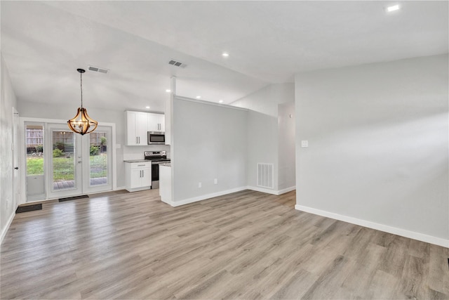2308 Foxcroft Ln, Arlington, TX 76014 - unfurnished living room featuring a chandelier, light wood-type flooring, baseboards, vaulted ceiling, and recessed lighting