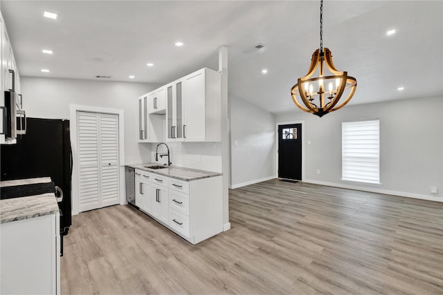 2308 Foxcroft Ln, Arlington, TX 76014 - kitchen with a chandelier, a sink, light wood-style flooring, white cabinets, and recessed lighting