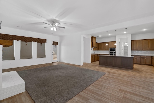 2213 Windy Hill Ln, Waxahachie, TX 75167 - unfurnished living room featuring a ceiling fan, light wood-type flooring, baseboards, and recessed lighting