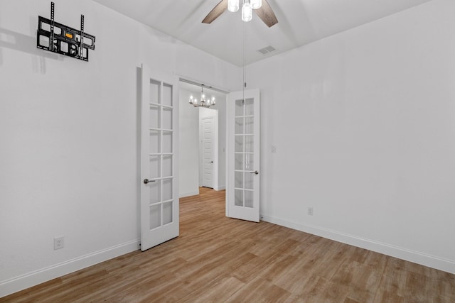 2213 Windy Hill Ln, Waxahachie, TX 75167 - unfurnished room featuring french doors, wood finished floors, a chandelier, and baseboards