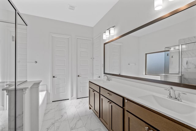 2213 Windy Hill Ln, Waxahachie, TX 75167 - bathroom with a marble finish shower, marble finish flooring, double vanity, and a bathtub