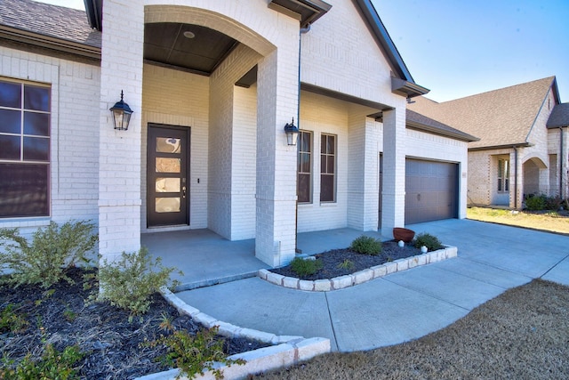 2213 Windy Hill Ln, Waxahachie, TX 75167 - entrance to property featuring covered porch, brick siding, and a garage