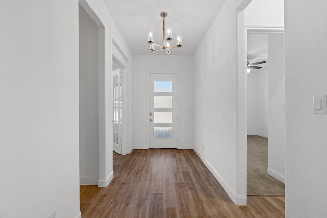2213 Windy Hill Ln, Waxahachie, TX 75167 - entrance foyer featuring a chandelier, wood finished floors, and baseboards
