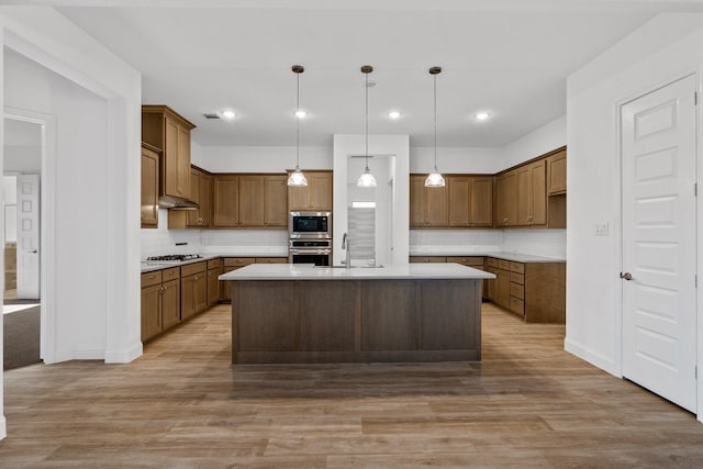 2213 Windy Hill Ln, Waxahachie, TX 75167 - kitchen featuring appliances with stainless steel finishes, backsplash, light countertops, light wood finished floors, and recessed lighting