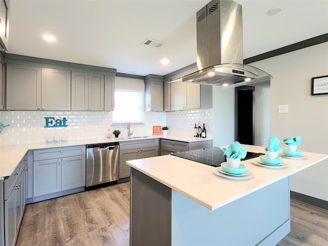 9306 High Noon Dr, Wylie, TX 75098 - kitchen featuring stainless steel dishwasher, island exhaust hood, gray cabinets, a sink, and light wood-style floors