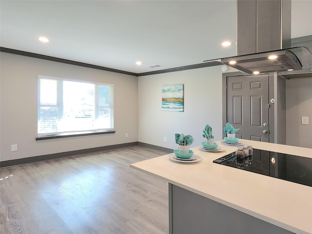 9306 High Noon Dr, Wylie, TX 75098 - kitchen featuring black electric stovetop, crown molding, light countertops, light wood-style flooring, and recessed lighting