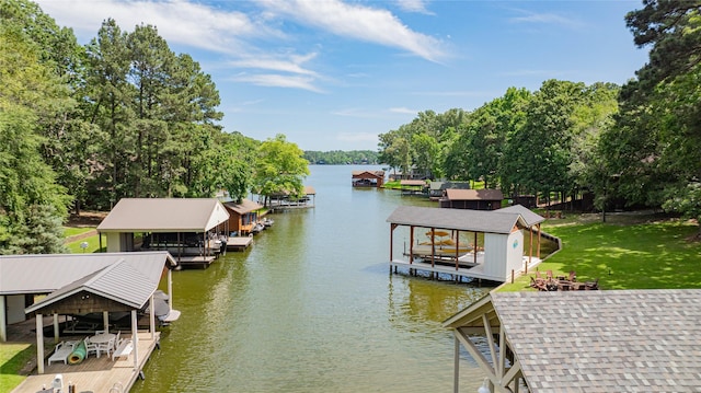 203 King Laurence, Scroggins, TX 75480 - dock featuring boat lift, a water view, and a lawn
