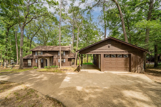 203 King Laurence, Scroggins, TX 75480 - view of front of house with driveway, a garage, and an outdoor structure