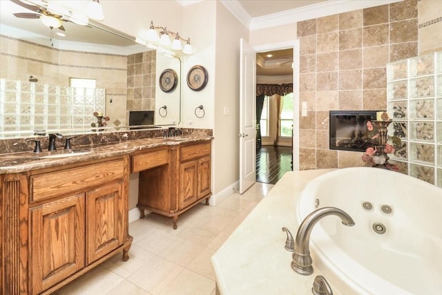 2221 Southern Oaks Dr, Cedar Hill, TX 75104 - full bath with crown molding, a tile fireplace, a jetted tub, double vanity, and tile walls
