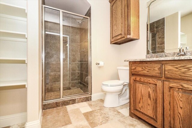 2221 Southern Oaks Dr, Cedar Hill, TX 75104 - full bath with toilet, vanity, a shower stall, and baseboards