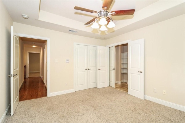 2221 Southern Oaks Dr, Cedar Hill, TX 75104 - unfurnished bedroom with carpet floors, a raised ceiling, a closet, and baseboards