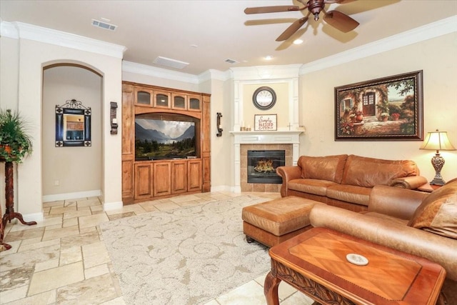 2221 Southern Oaks Dr, Cedar Hill, TX 75104 - living room featuring a ceiling fan, ornamental molding, a tiled fireplace, stone tile flooring, and recessed lighting