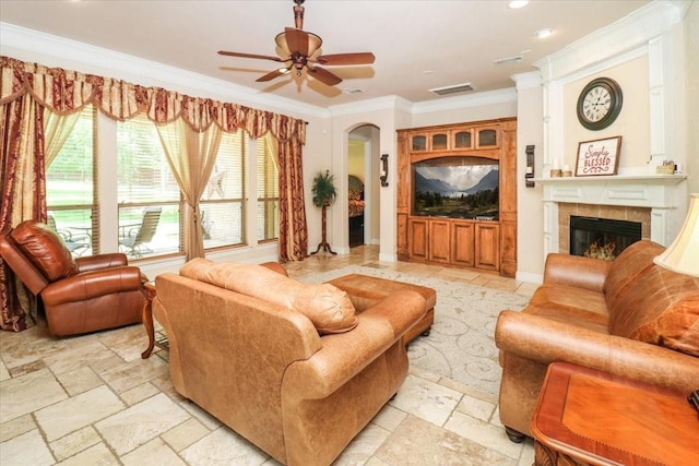 2221 Southern Oaks Dr, Cedar Hill, TX 75104 - living room with crown molding, a fireplace, ceiling fan, stone tile flooring, and recessed lighting