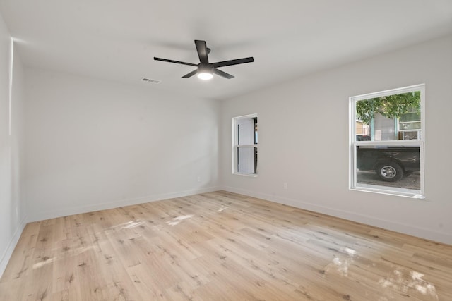 3009 Ave H, Fort Worth, TX 76105 - unfurnished room featuring wood finished floors, ceiling fan, and baseboards