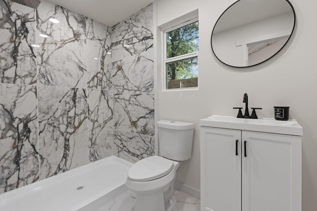 3009 Ave H, Fort Worth, TX 76105 - bathroom featuring vanity, a marble finish shower, marble finish floors, toilet, and baseboards
