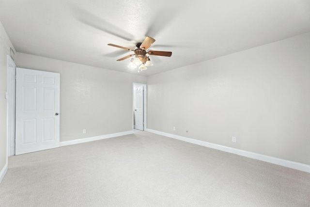 600 Via Del Sur Spur, Mesquite, TX 75150 - empty room featuring a ceiling fan, light colored carpet, and baseboards