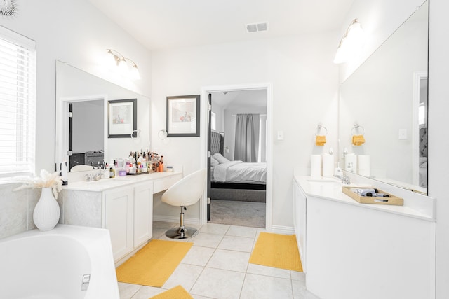 2702 Willow Ln, Melissa, TX 75454 - bathroom featuring connected bathroom, vanity, tile patterned flooring, and plenty of natural light