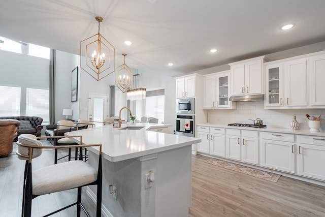 2702 Willow Ln, Melissa, TX 75454 - kitchen with stainless steel appliances, a sink, healthy amount of natural light, a chandelier, and recessed lighting