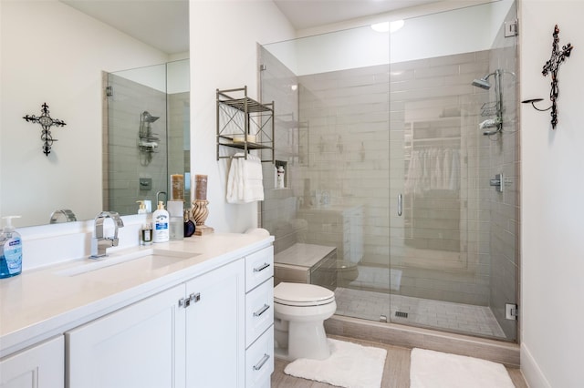 5270 Town And Country Unit 326, Frisco, TX 75034 - full bathroom featuring vanity, a shower stall, and toilet
