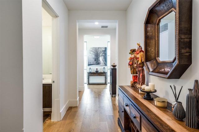 5270 Town And Country Unit 326, Frisco, TX 75034 - hall featuring light wood-style flooring, baseboards, and recessed lighting