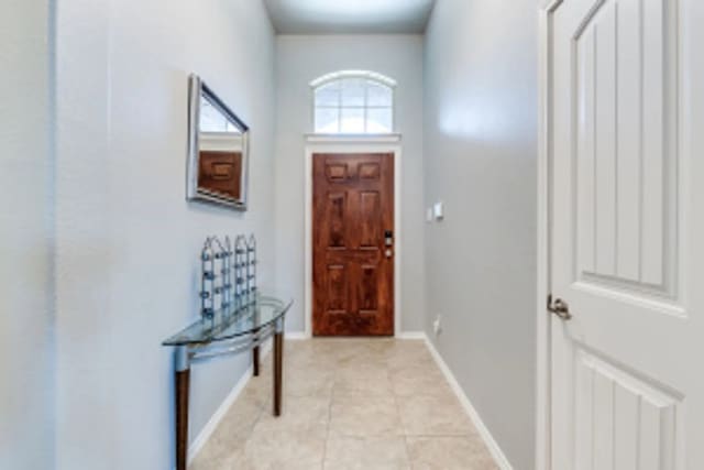 11520 Starlight Ranch Trl, Fort Worth, TX 76052 - foyer with light tile patterned floors and baseboards