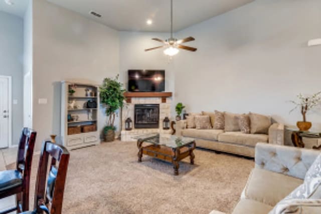 11520 Starlight Ranch Trl, Fort Worth, TX 76052 - living area featuring a stone fireplace, ceiling fan, and high vaulted ceiling